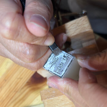 Tracing the design onto the stone