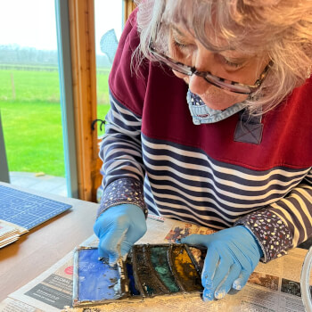 Cementing and polishing the panel