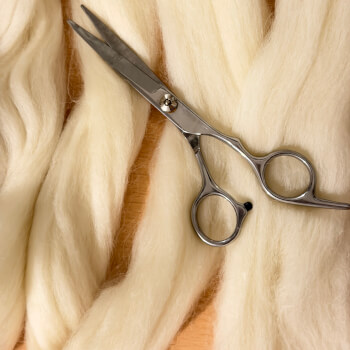 Preparing natural wool