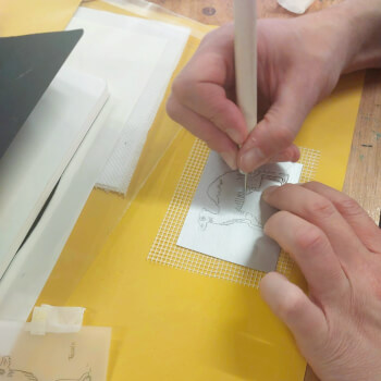 Scratch your drawing into the plate