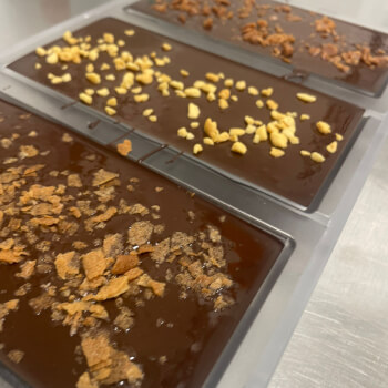 Mould your chocolate and top it from several options 
