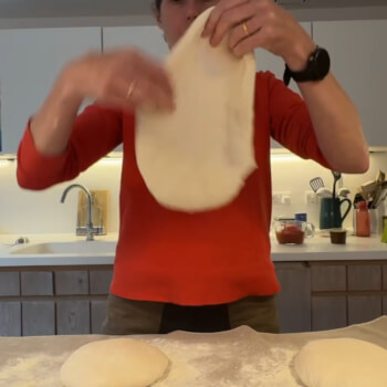 Stretching the pizza dough