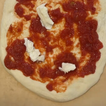 Topping the pizza