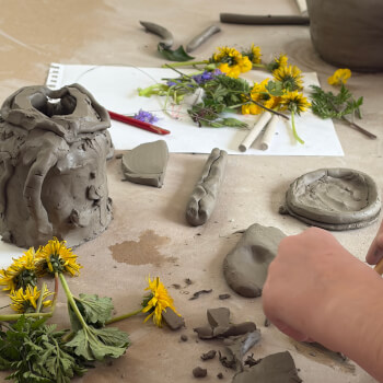Incorporating botanicals into clay 