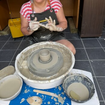 Come learn to throw clay with a smile 