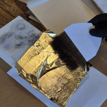 Apply gold or silver leaf foil