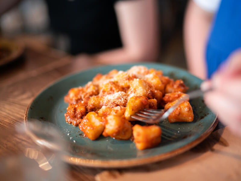 A plate of homemade gnocchi crafted in a cooking course.
