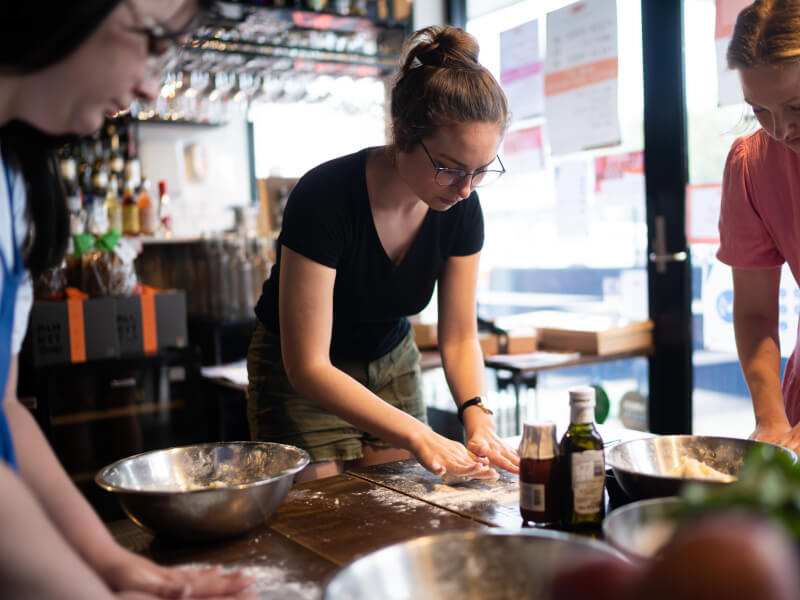 Students working at a vegan cooking class