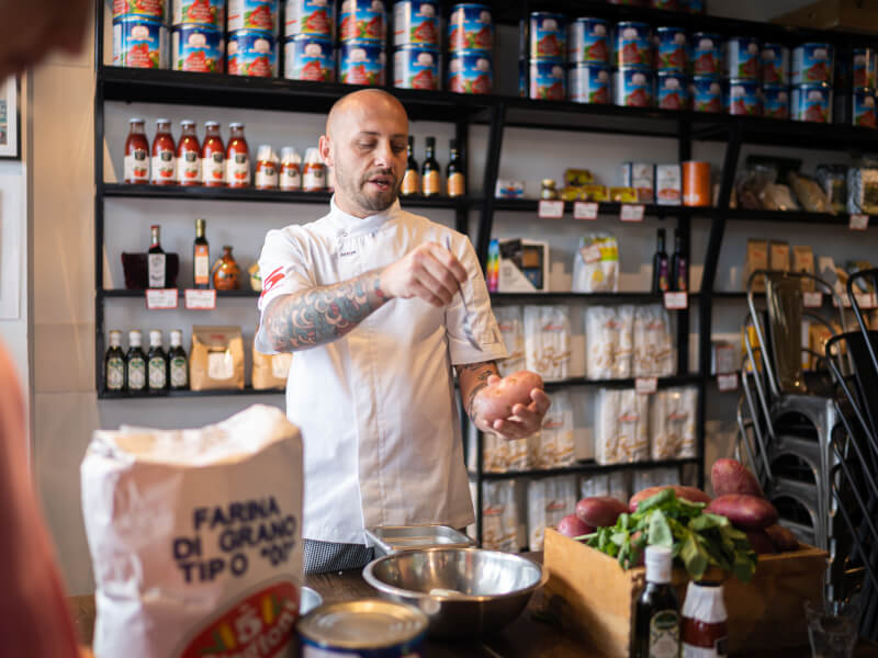 Chef teaching an Italian cooking class in London.