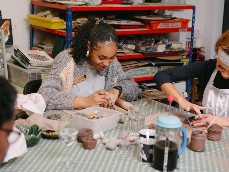 Students at a pottery workshop