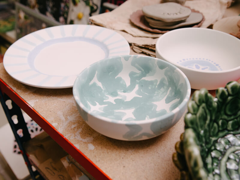 Close up of a variety of finished painted ceramics