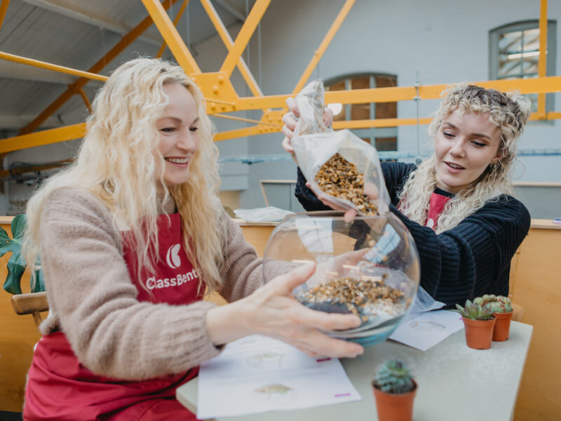 Mother and daughter making a DIY terrarium