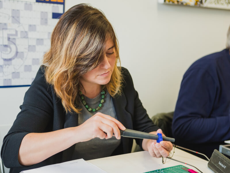 A woman sizing a ring at a jewellery making class