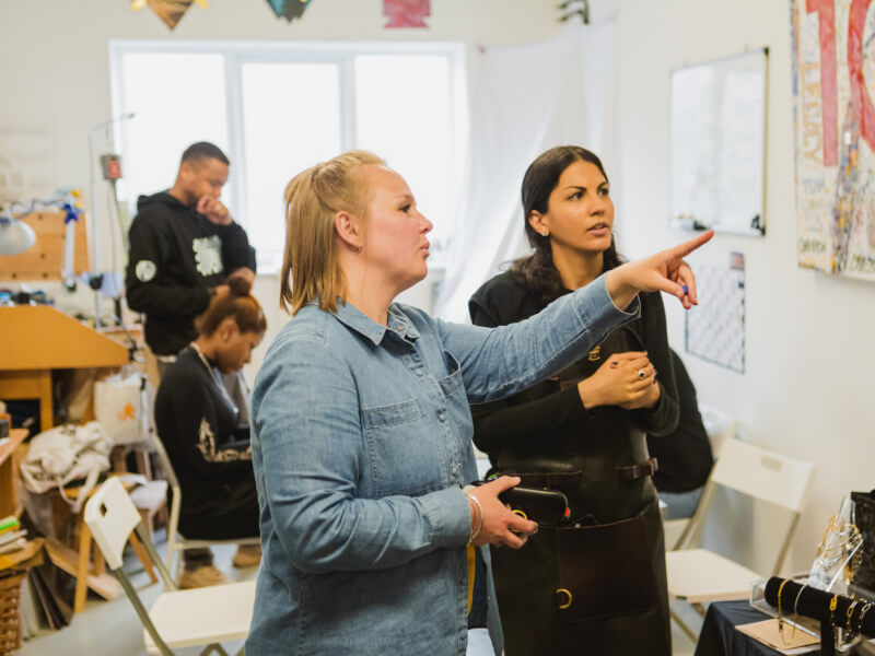 A group of people in a jewellery making workshop