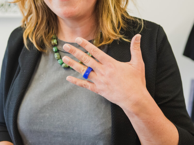 A woman showing off her handmade ring mould