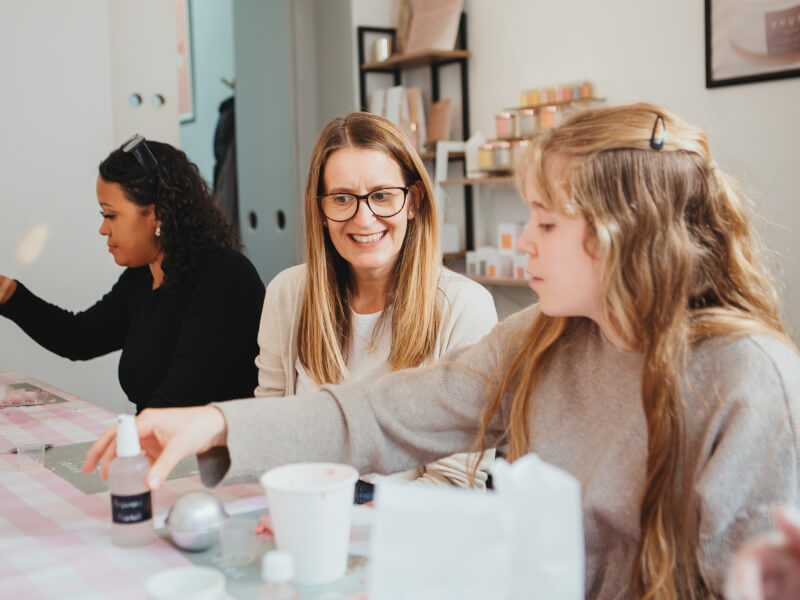 Woman smiling at a craft class