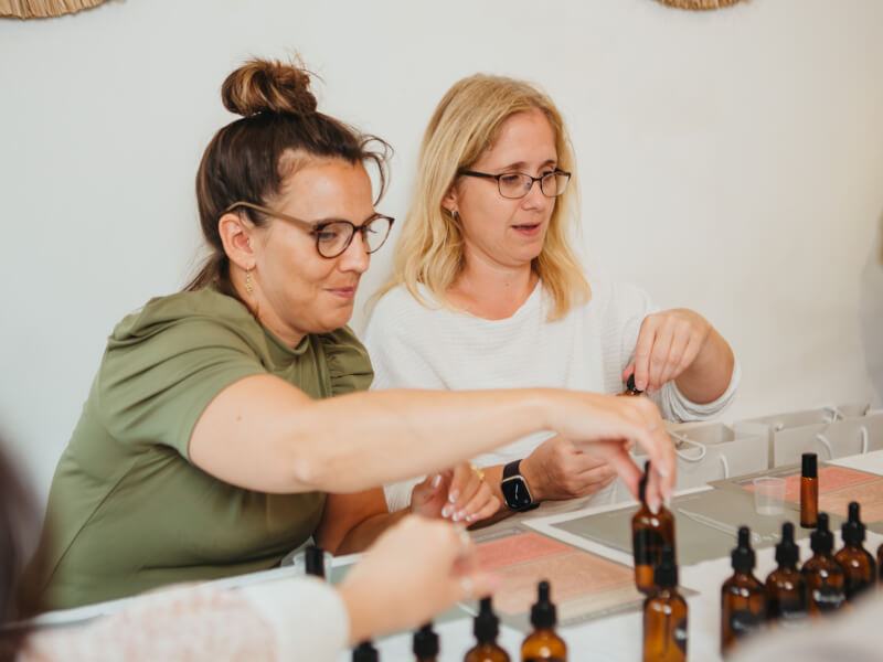 Two women at a perfume making class