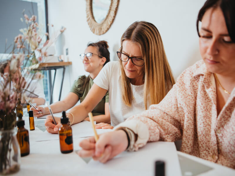 Three women at a candle making class