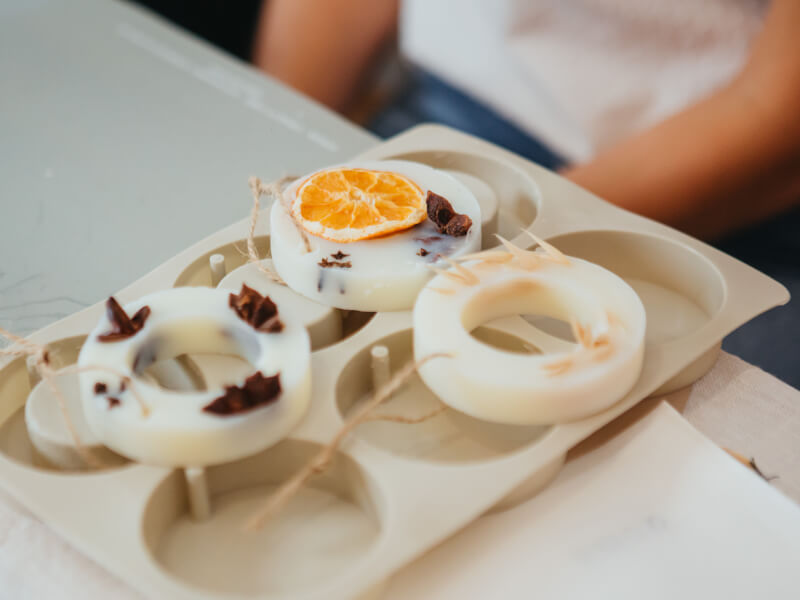 Handmade eco friendly festive decorations filled with sliced orange and cinnamon