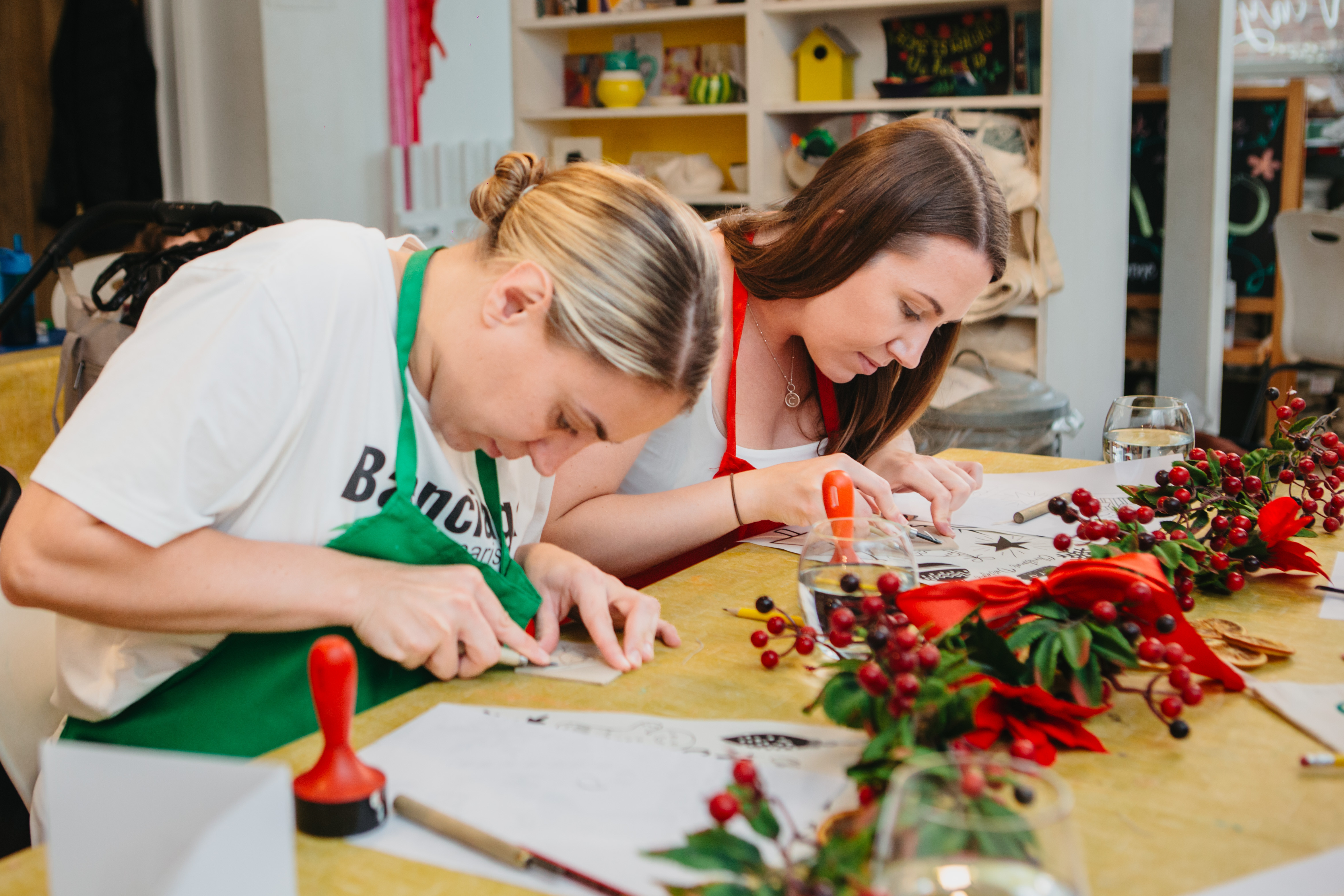 A couple working on a festive lino print together