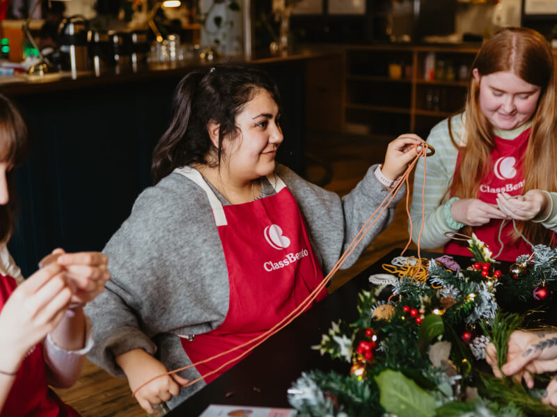 Three people enjoying a Christmas craft class together