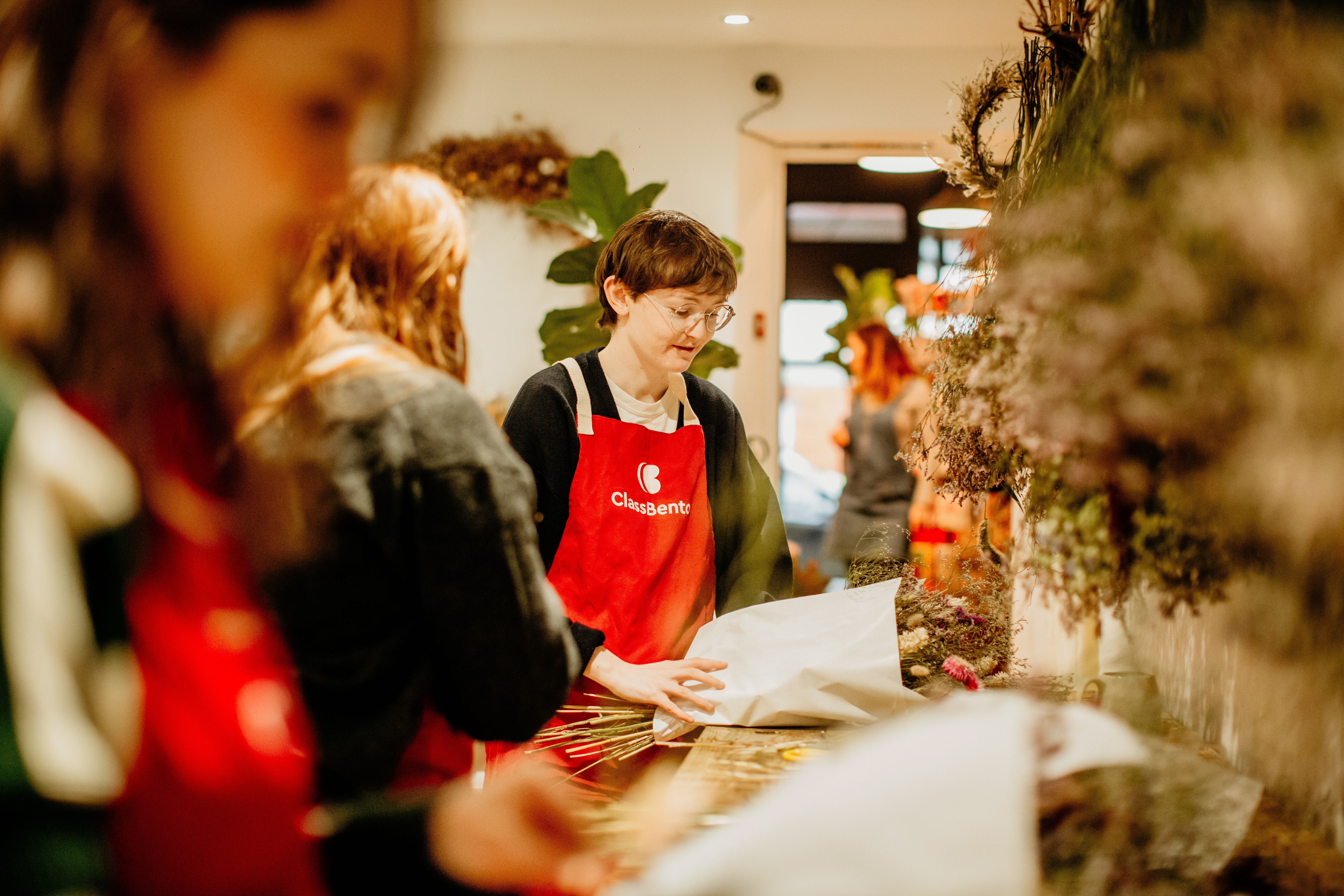 A group of students working at a floristry class