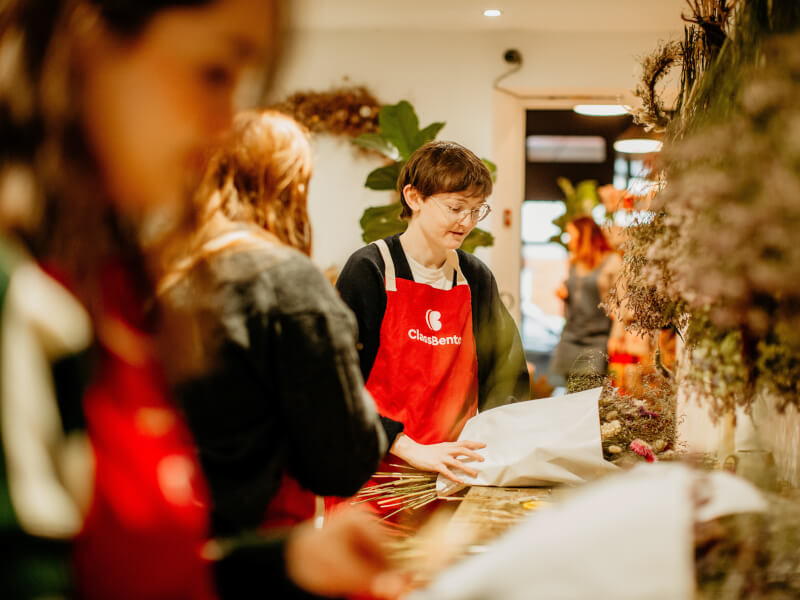 A group of students at a pottery class