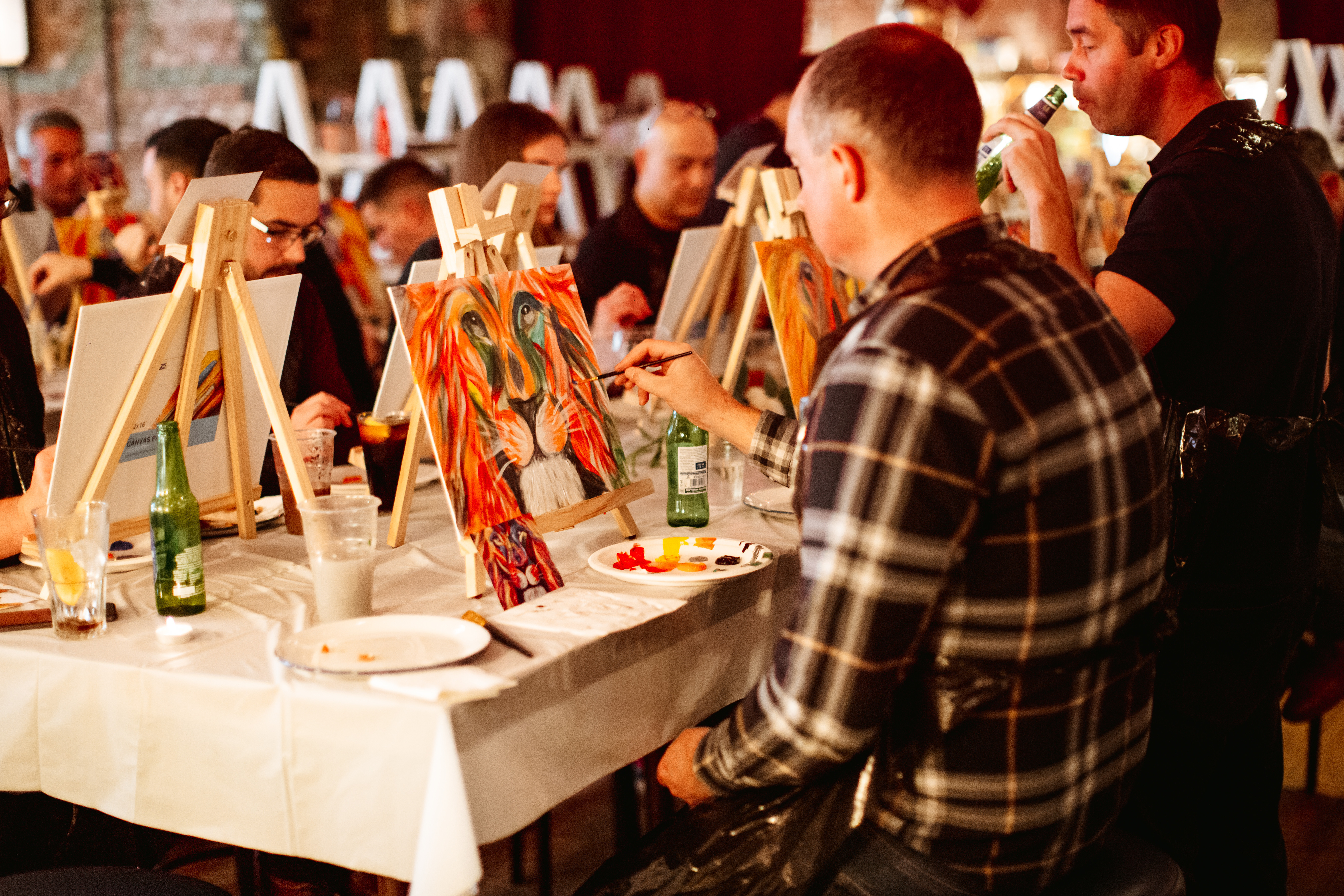 A group of people at a painting workshop