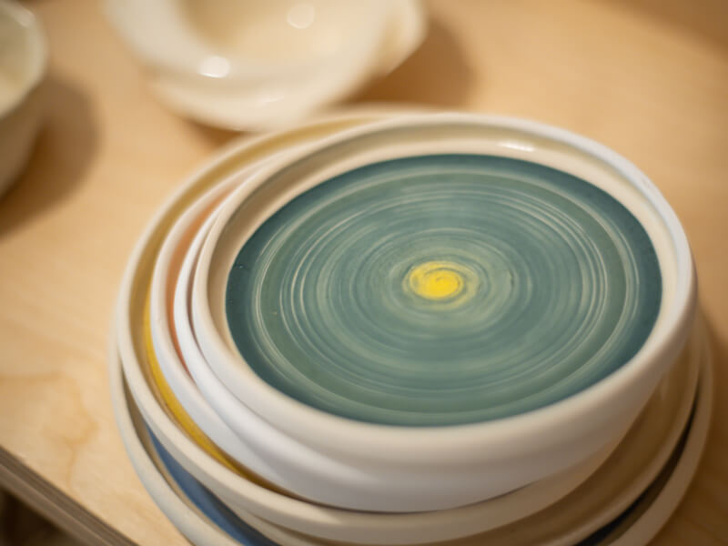 A pile of painted ceramic plates