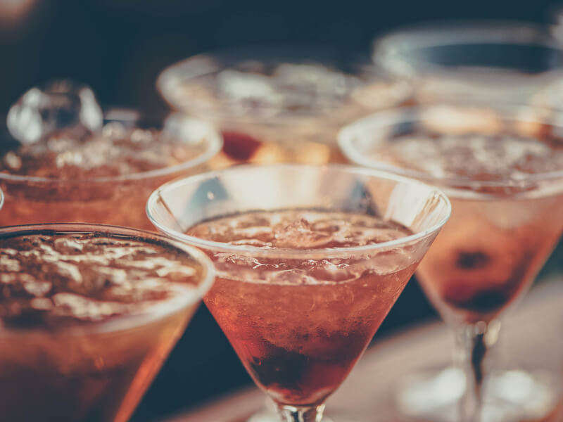Several cocktails in cocktail glasses