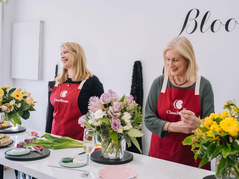 Mother and daughter working together at a floristry class