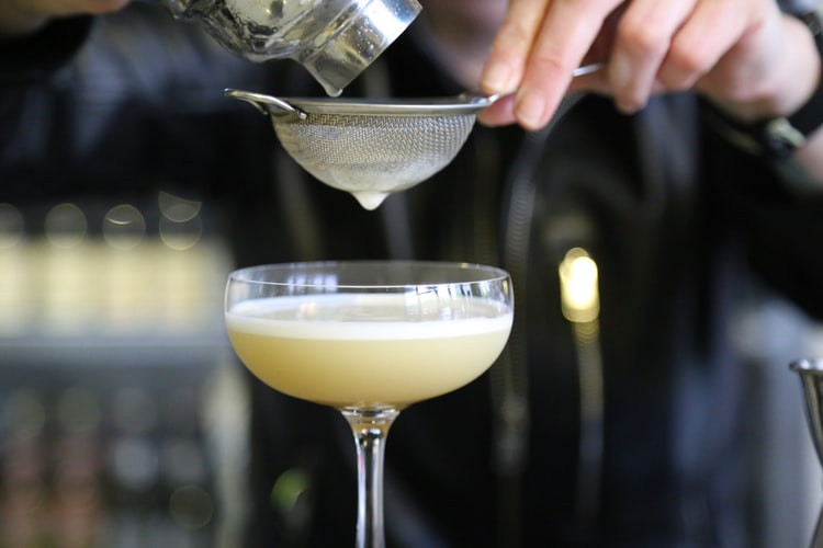 A man pouring DIY cocktails.