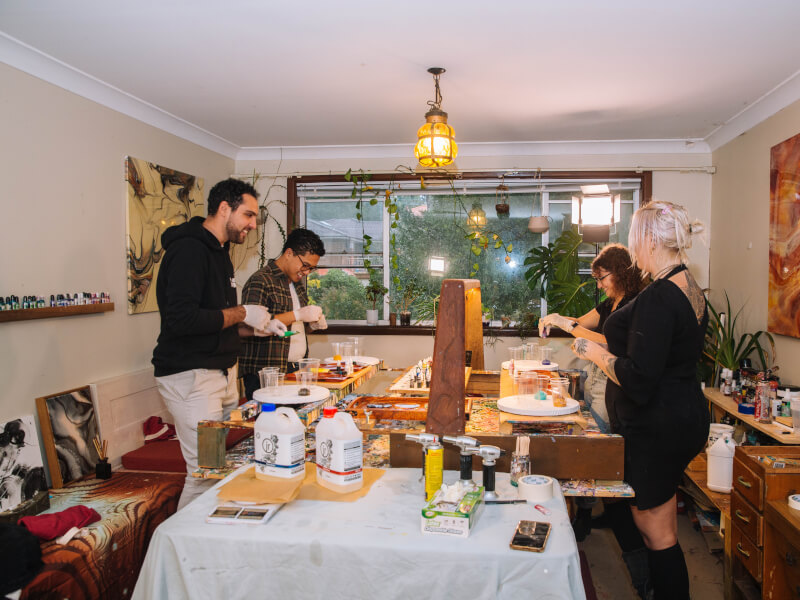 Group of people at a fluid art workshop