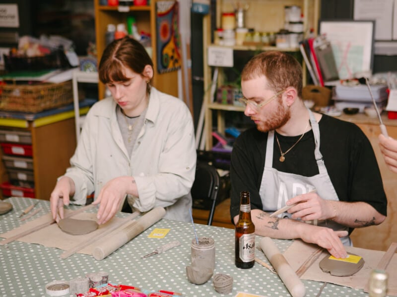 A couple enjoying a hand building pottery class together