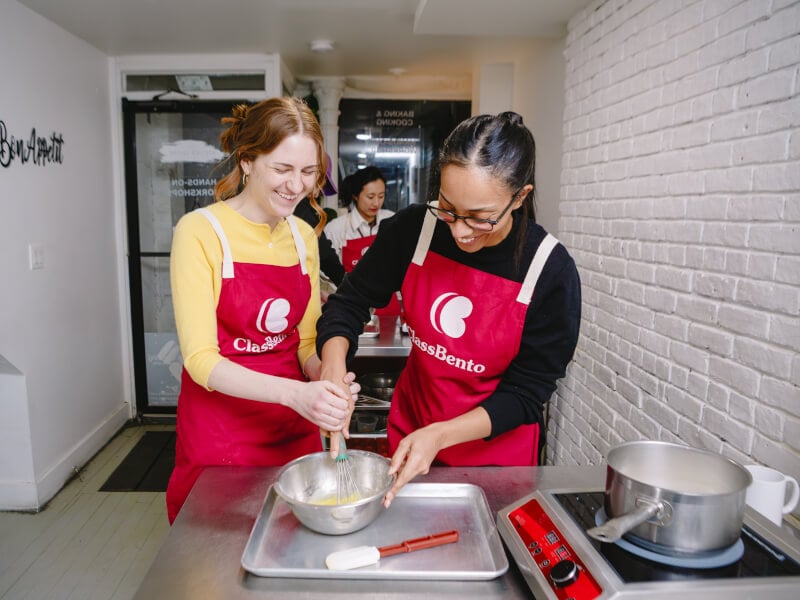 A student and teacher at a baking class