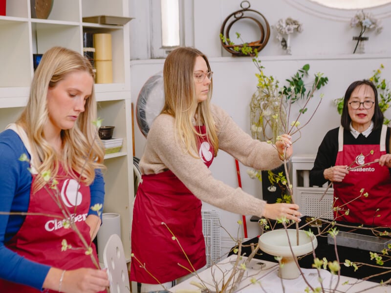 A couple working together at an ikebana class