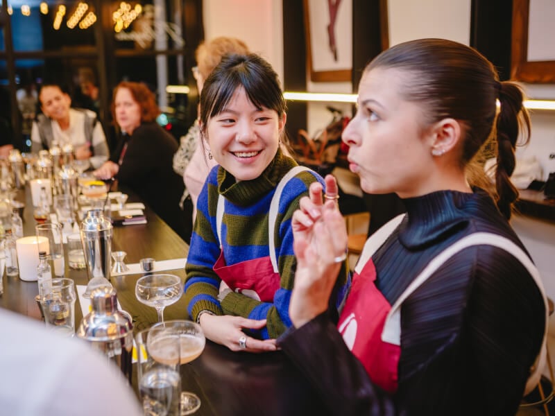 A couple trying drinks together at a cocktail making class.