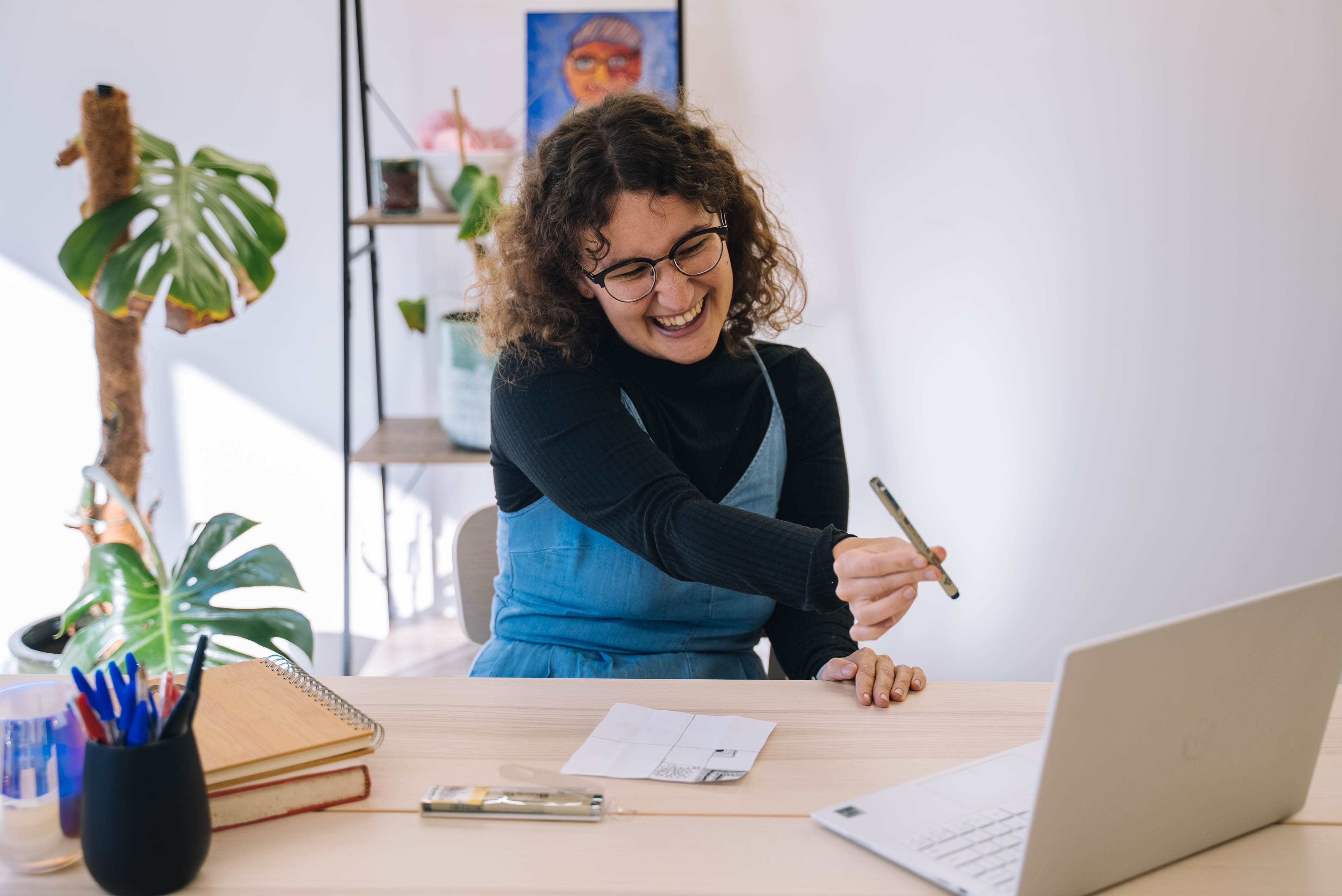 A person smiling whilst enjoying an online crafting class