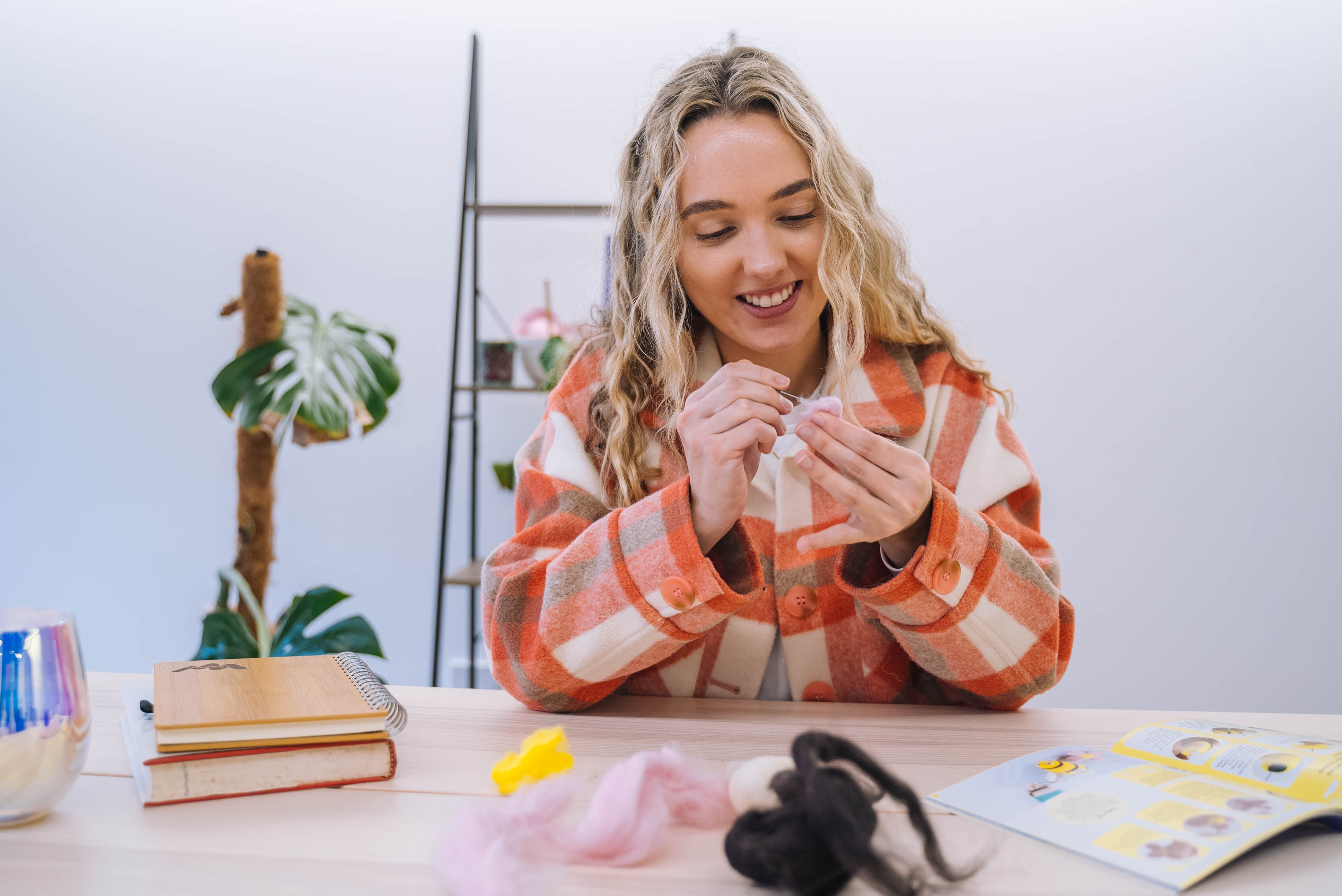 A person enjoying the craft kit they've purchased