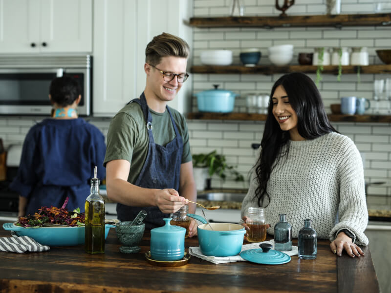 Two people enjoying a cooking class