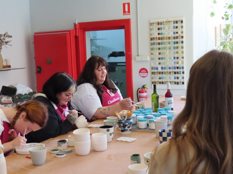 People painting pottery in Gloucester