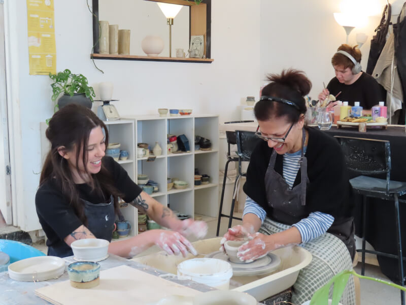 A woman at a pottery class