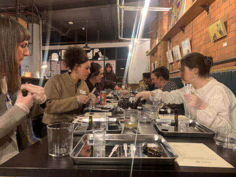 Women making perfume in a perfume making class