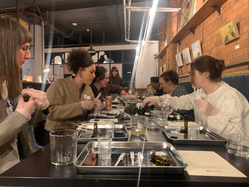 Women taking part in a perfume making class.