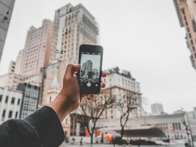 A man practicing iPhone photography