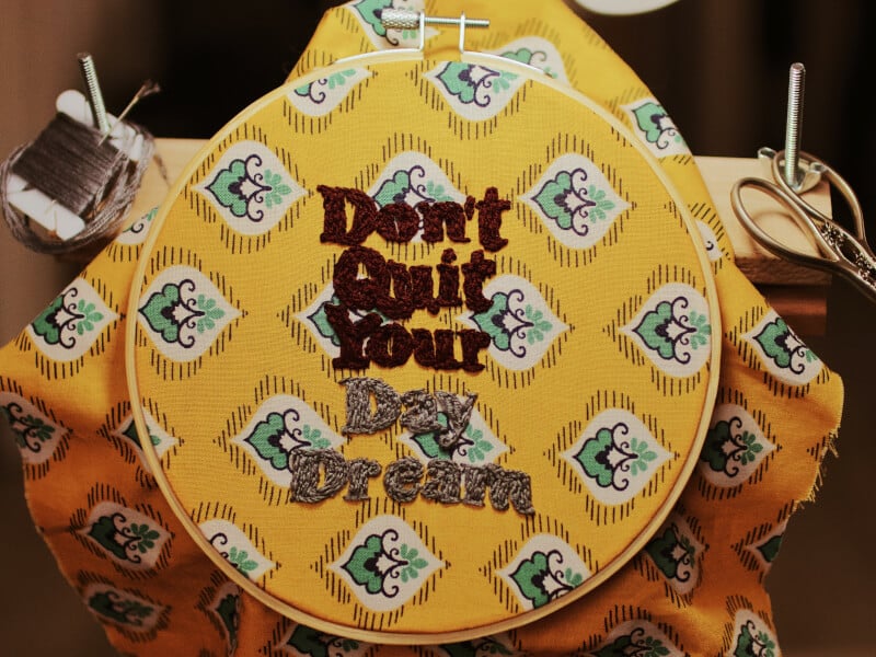 Slogan embroidered in a circle frame
