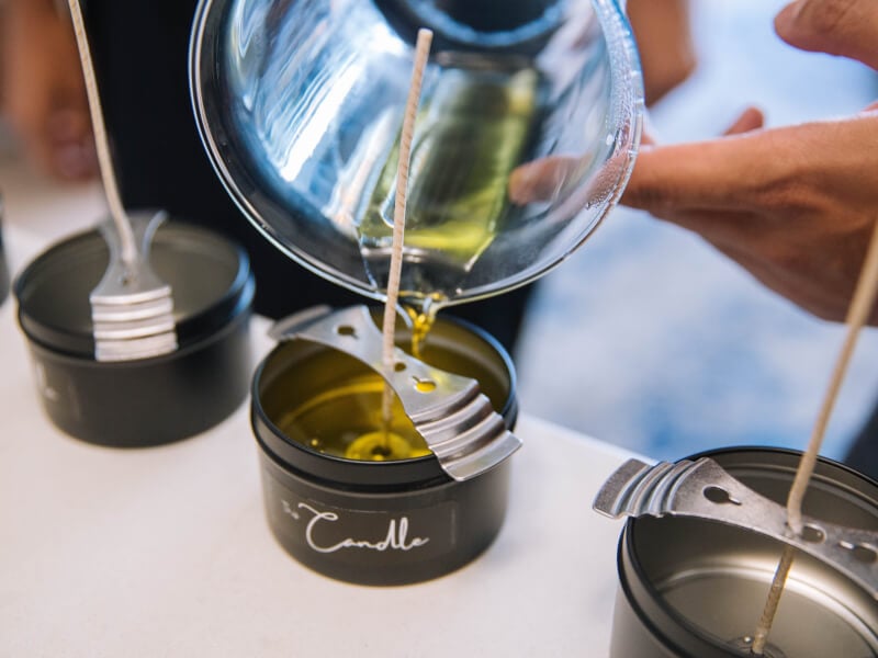 Pouring wax into a handmade soy candle