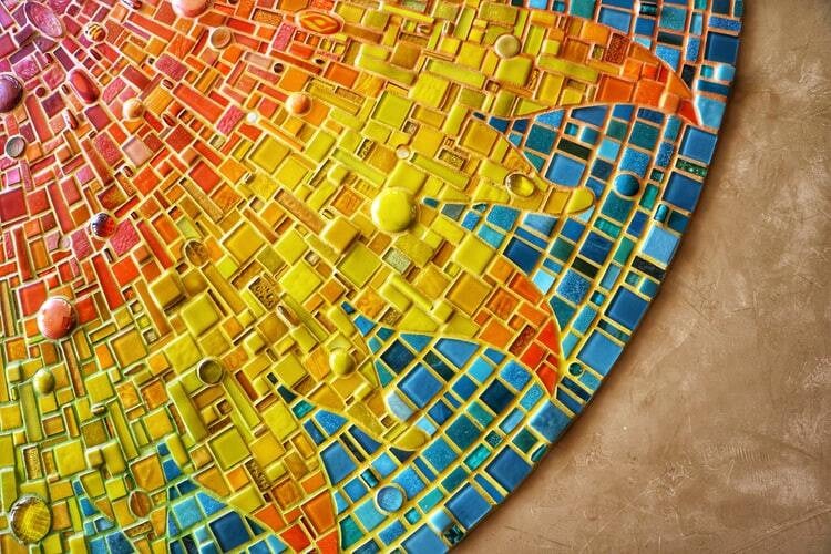 A multicoloured mosaic sun