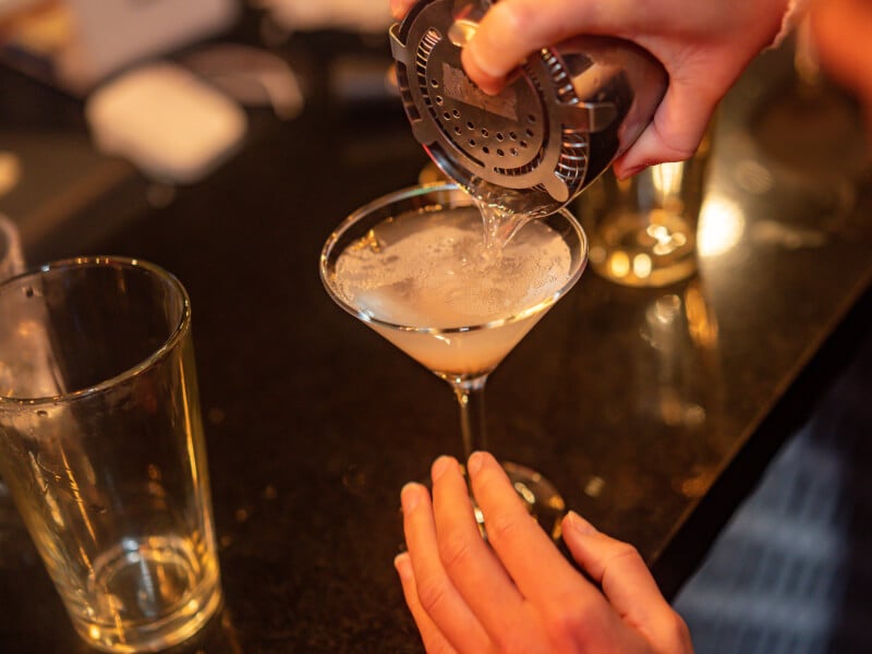 Cocktail being poured at a cocktail making class in London