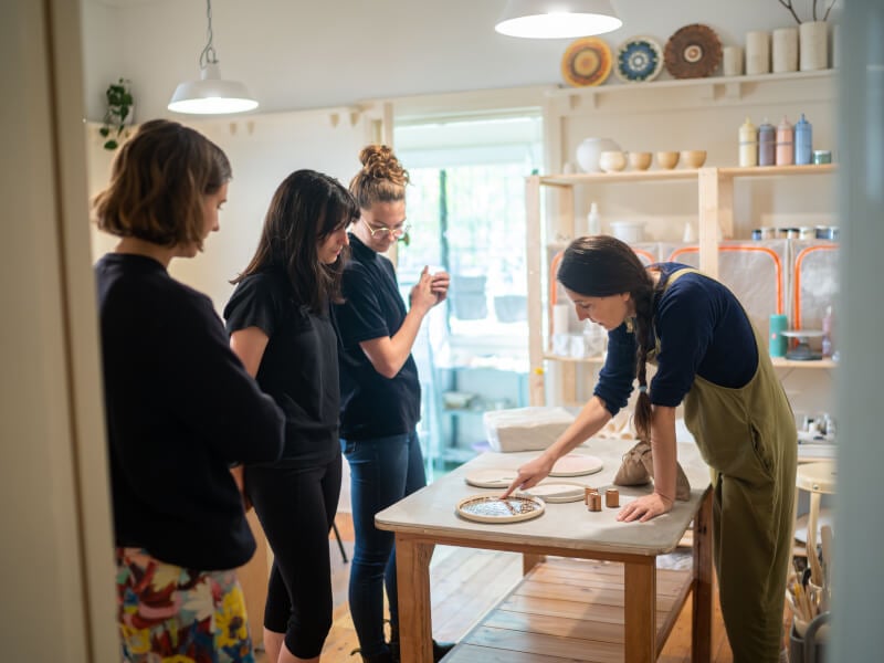 People at a team building pottery class in London
